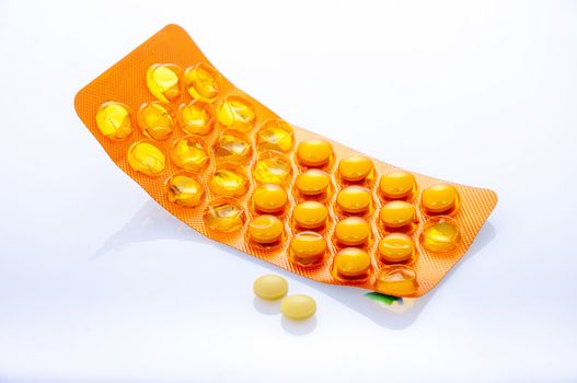 an image of orange pills isolated on white