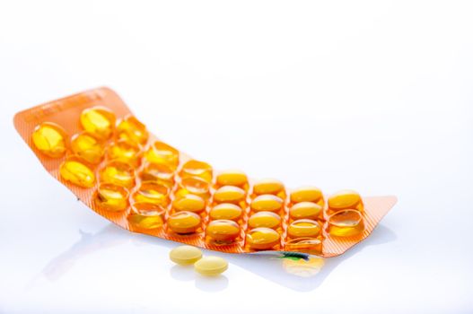 an image of orange pills isolated on white