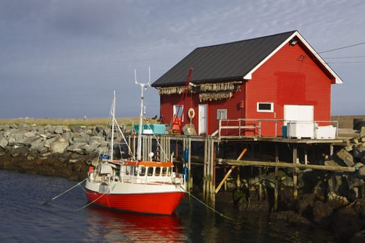 Norwegian fishing boat with fishing house on island of Vaeroy, Lofoten