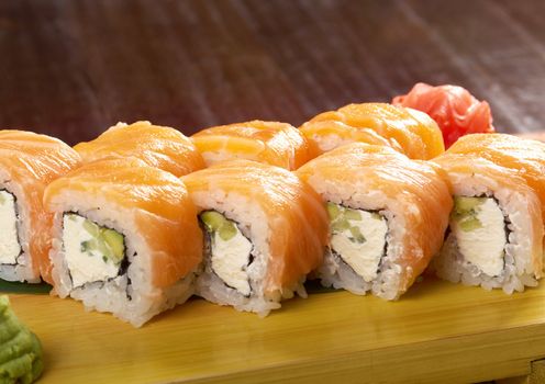 Philadelphia classic. Salmon, Philadelphia cheese, cucumber, avocado, tobiko. Japanese sushi