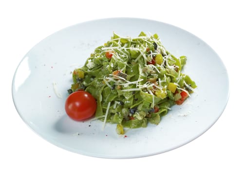 Tagliatelle pasta with pesto.Selective focus isolated on white background.
