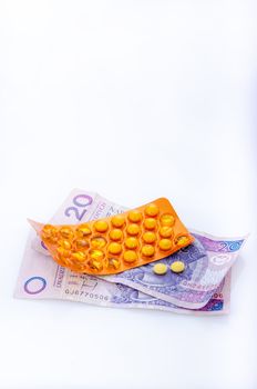 an image of pills and polish money zloty