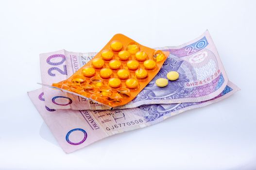 an image of pills and polish money zloty