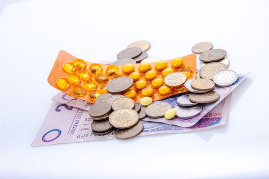an image of pills and polish money zloty