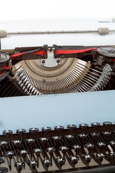 retro typewriter close up with detail of keys and letters mechanism