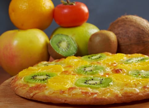 homemade sweet pizza with fruit.with orang kiwi,sauce