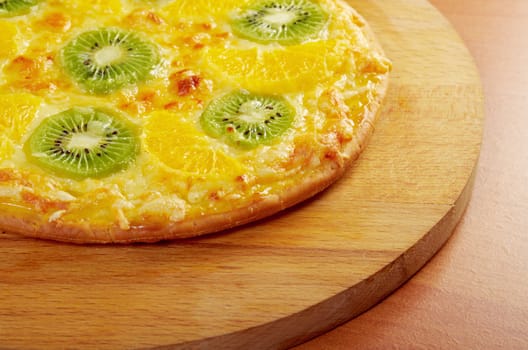 homemade sweet pizza with fruit.with orang kiwi,sauce