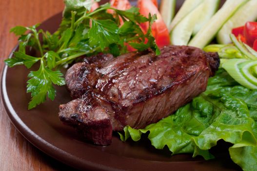Grilled beef on white plate  with vegetable