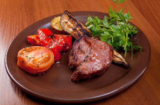 Grilled beef on white plate  with vegetable