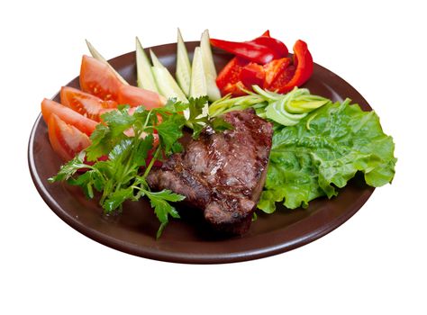 Grilled beef on white plate  with vegetable.isolated on white background.