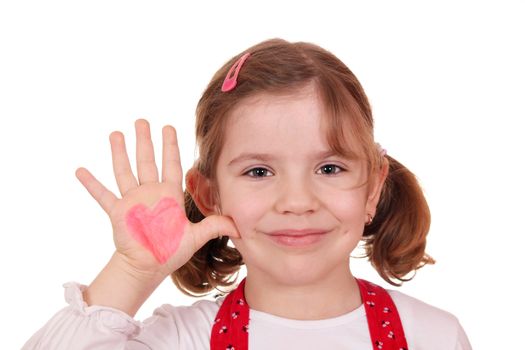 happy little girl with heart on hand