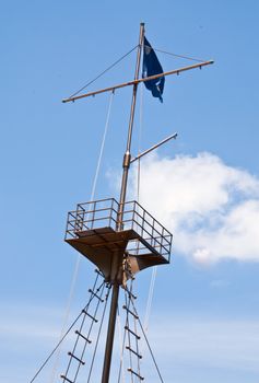 Mast of the ship on the sky background.