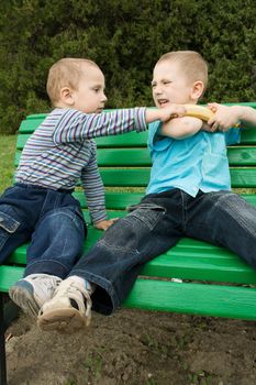 boys are fighting because of the banana