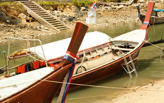 Local fishing boats. Moored in the harbor where the water is not deep.