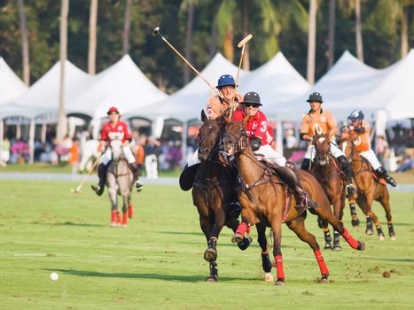 PATTAYA - JANUARY 19: Players fighting for the ball during the final between Thai Polo and Axus at Thai Polo Open on January 19, 2013 in Pattaya, Thailand.