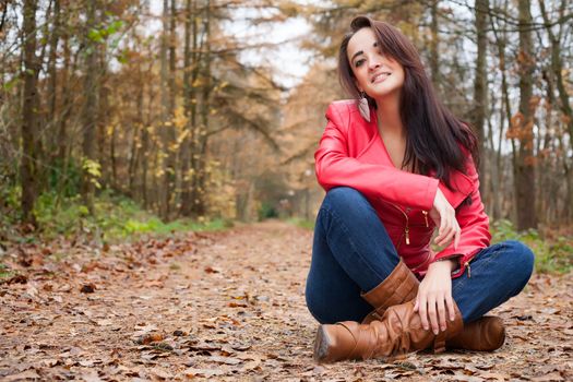 Beauty young woman in the forest is having a nice time