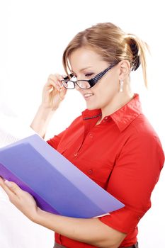 Portrait of a beautiful young business woman holding a folder, considering options