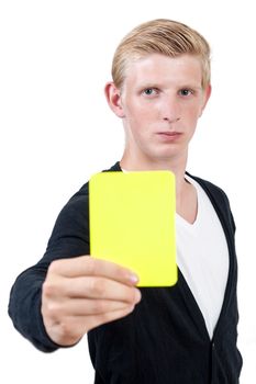 Attractive young man showing yellow card  - isolated on white background