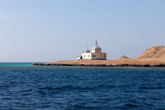 Sea Radar on stony bare mountain under a clear blue sky