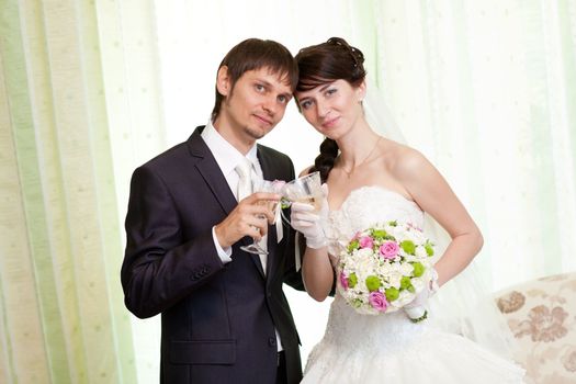 bride and groom with champagne