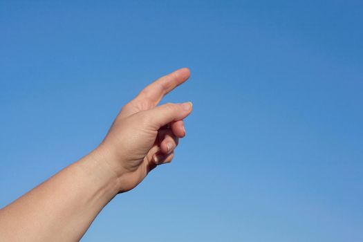 Finger the woman on a blue background