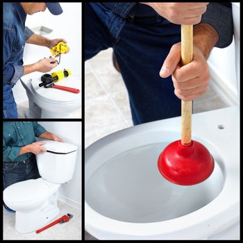 Plumber repairing a flush toilet. Plumber. Worker.