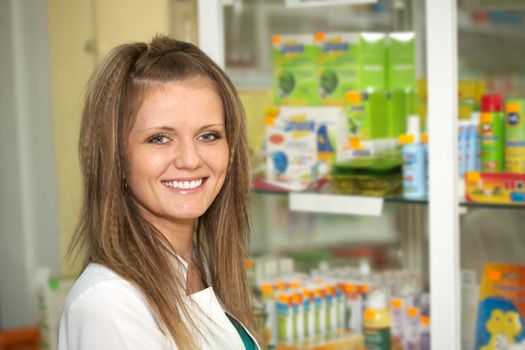 Medicine. Chemist woman standing in pharmacy drugstore 