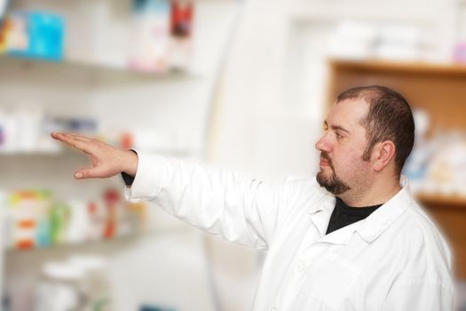 Portrait of a male pharmacist at pharmacy. Medicine 