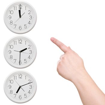 Three clock. Finger points to the clock on a white background