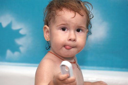 The child bathes in a bathroom. Cleanliness and health