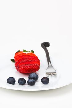 Plate with berry   and fork