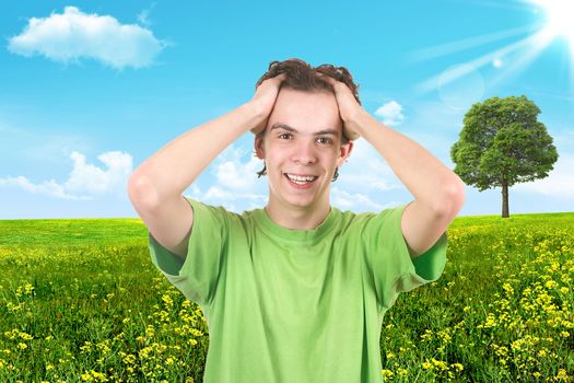 The joyful teenager on a green background. Summer