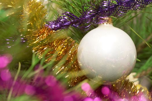 Xmas tree. White glass sphere.  Sparkling tree ornament 