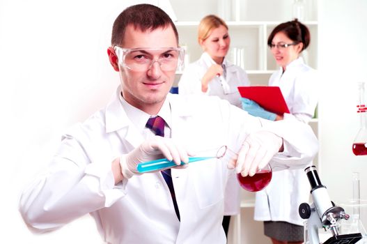 chemist working in the laboratory, mix liquid