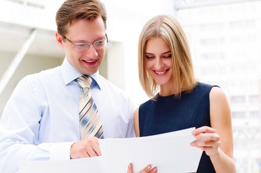 Portrait of young male and female entrepreneurs working together