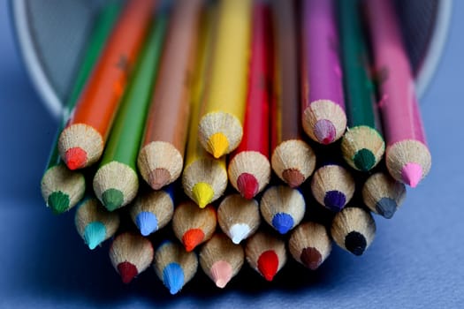 Colored pencils with blue background