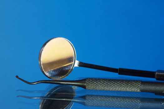 Set of dental tools on a blue background