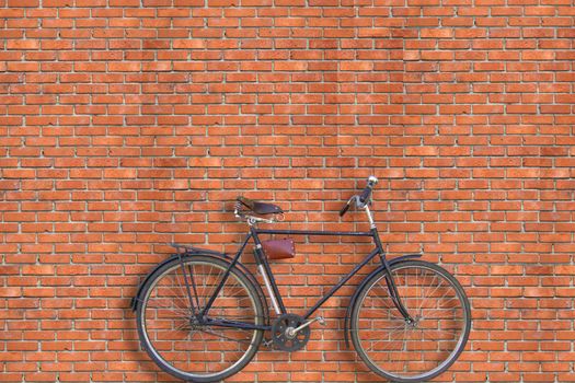 The bicycle stands near a wall from a red brick