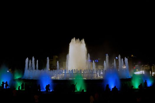 Barcelona Magic Fountain with silhouette of the people, Spain