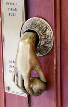 Antique bell pull on a door in Barcelona Spain
