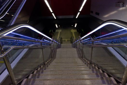 Stairway and eksalator blue light, stairway - Metro a station Barcelona