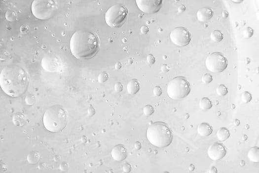 drops of water on glass, gray background
