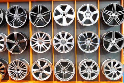 Car wheel aluminum rims on wall