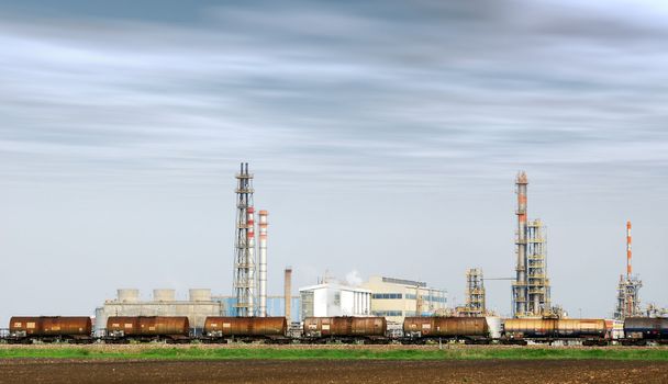 Heavy industry factory with train tanks