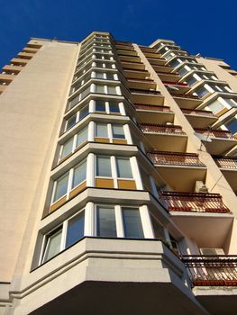 The multi-storey modern house on the blue sky background