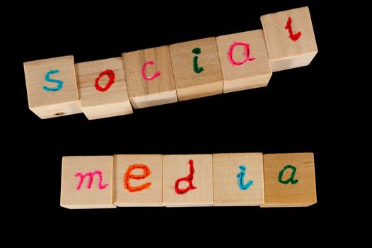 Social media words on group of wooden cube