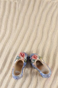 A pair of shoes on the sand