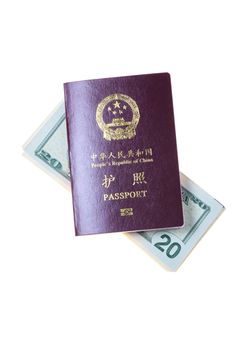 Chinese passport and a pile of US Dollars isolated on white