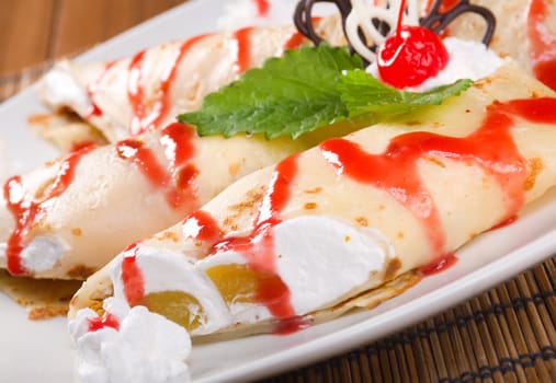 Dessert - Pancakes with cerise Sauce . Shallow depth-of-field.