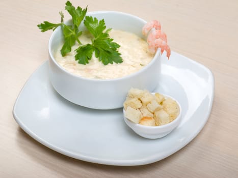 vegetable cream soup with prawns  close up 